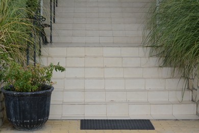 View of stone outdoor staircase decorated with plants