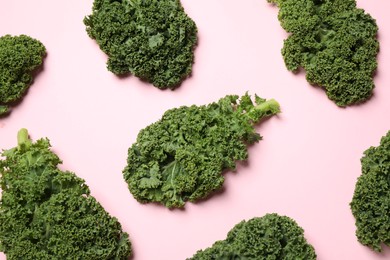 Fresh kale leaves on pink background, flat lay