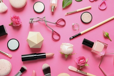 Photo of Flat lay composition with products for decorative makeup on pink background