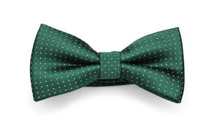 Stylish green bow tie with polka dot pattern on white background, top view