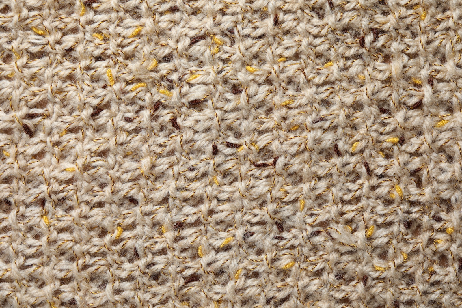 Photo of Texture of knitted fabric as background, top view