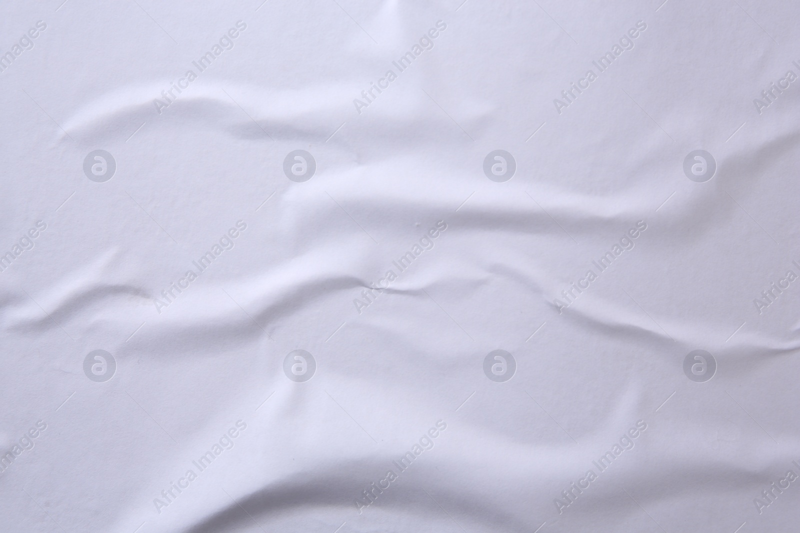 Photo of Texture of white creased paper, closeup view