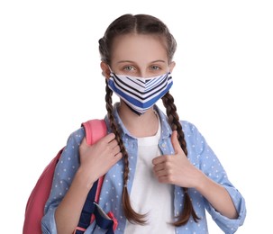 Photo of Schoolgirl wearing protective mask and backpack on white background. Child's safety from virus
