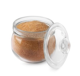 Photo of Glass jar of granulated brown sugar isolated on white
