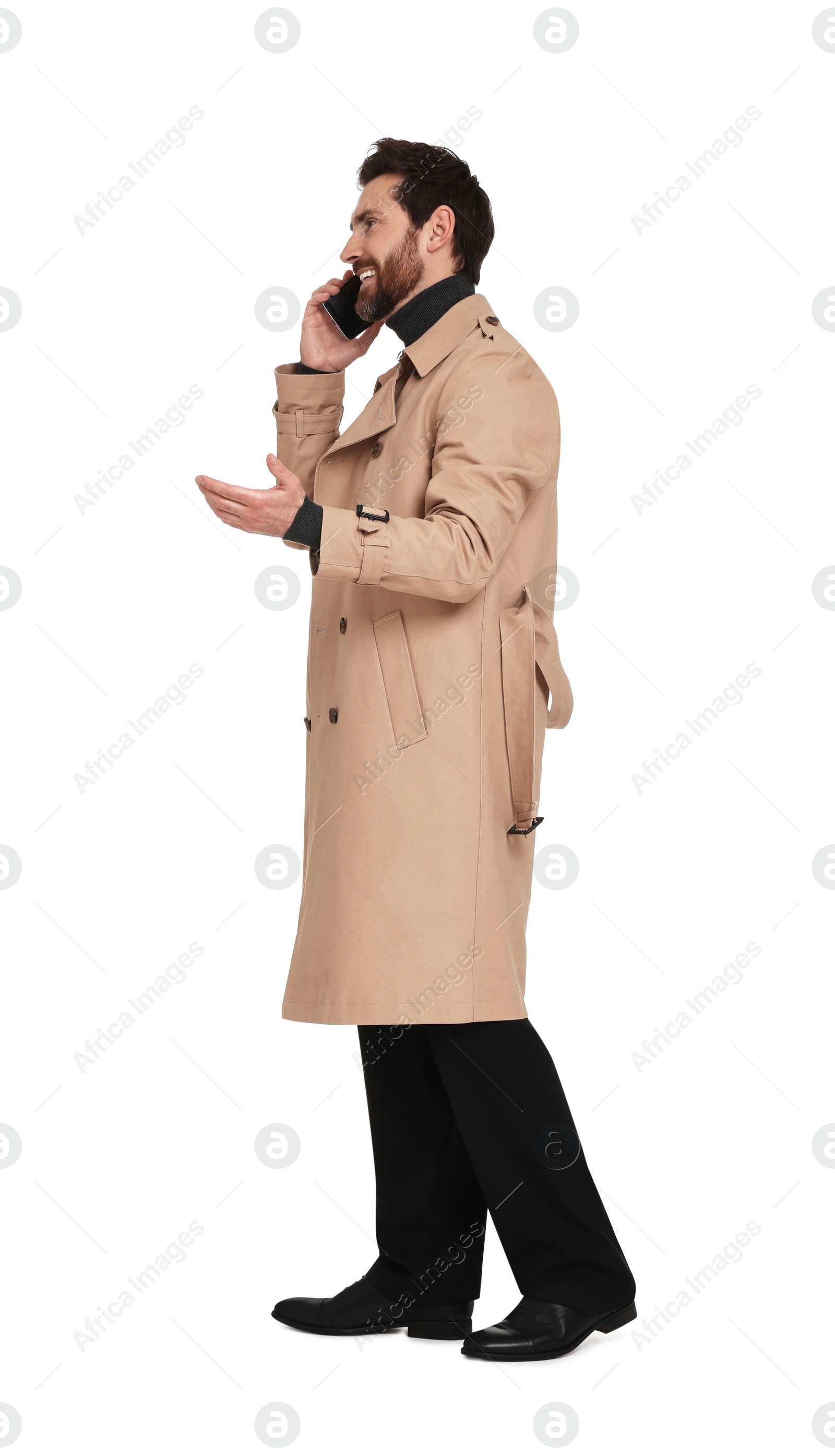 Photo of Handsome man talking on phone against white background