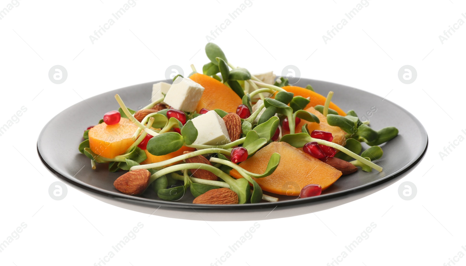 Photo of Delicious persimmon salad with feta cheese and pomegranate isolated on white