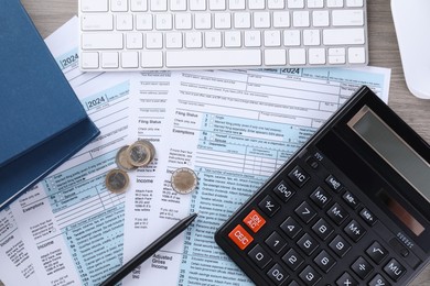 Tax accounting. Flat lay composition with calculator and documents on wooden table