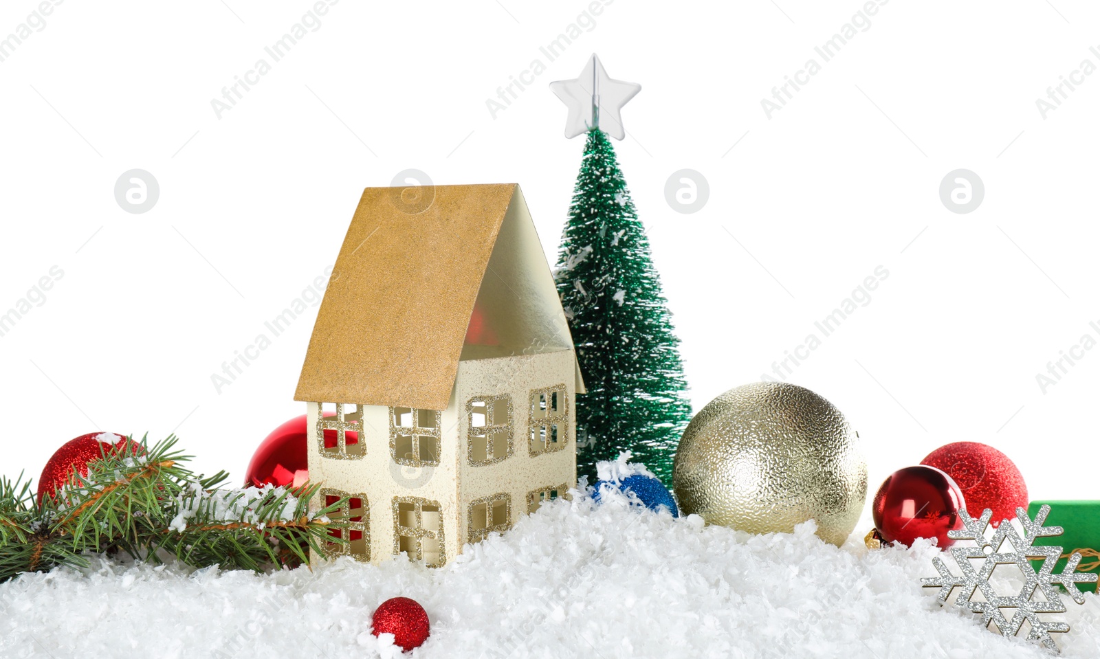 Photo of Christmas decoration on snow against white background