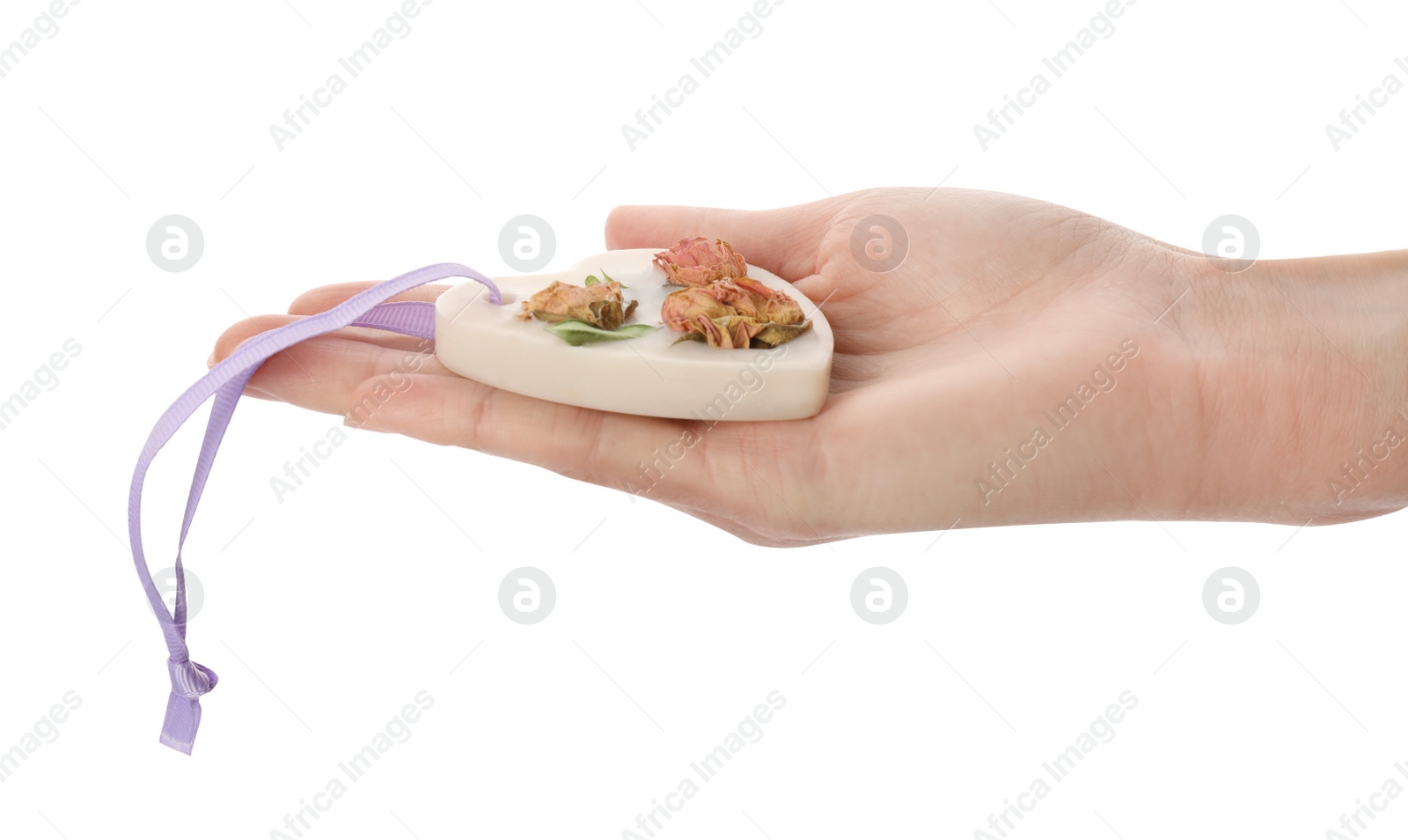 Photo of Woman holding scented sachet with flowers on white background, closeup