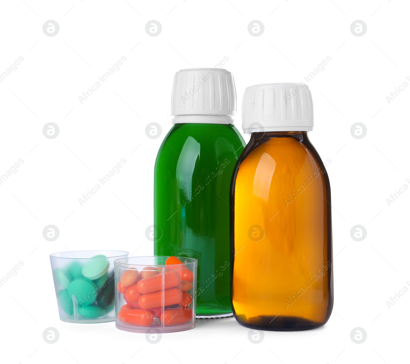 Photo of Bottles of syrups with pills on white background. Cough and cold medicine