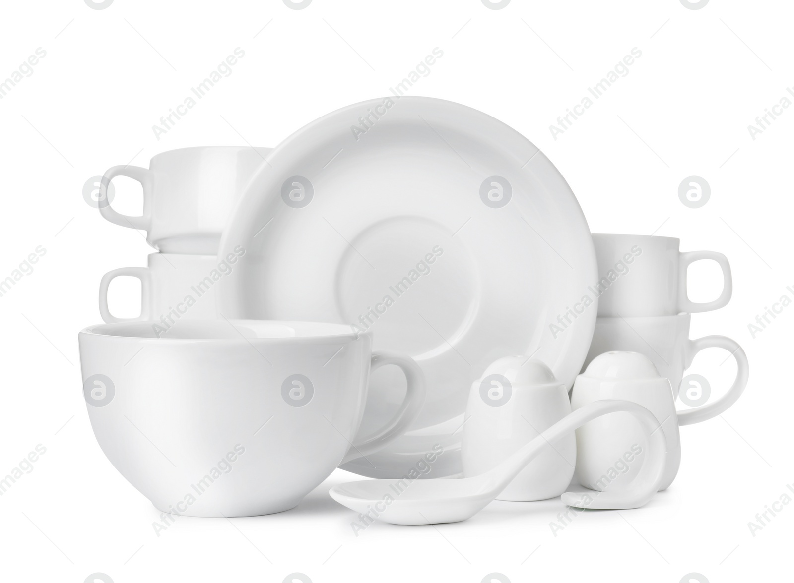 Photo of Set of clean dishware isolated on white