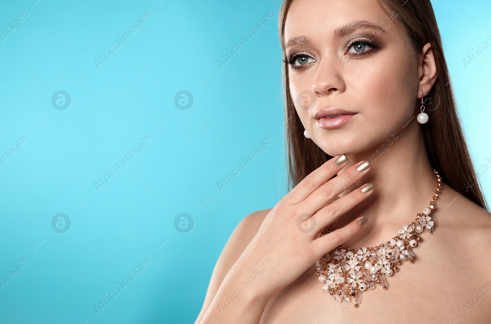 Photo of Beautiful woman with stylish nail polish on color background, space for text