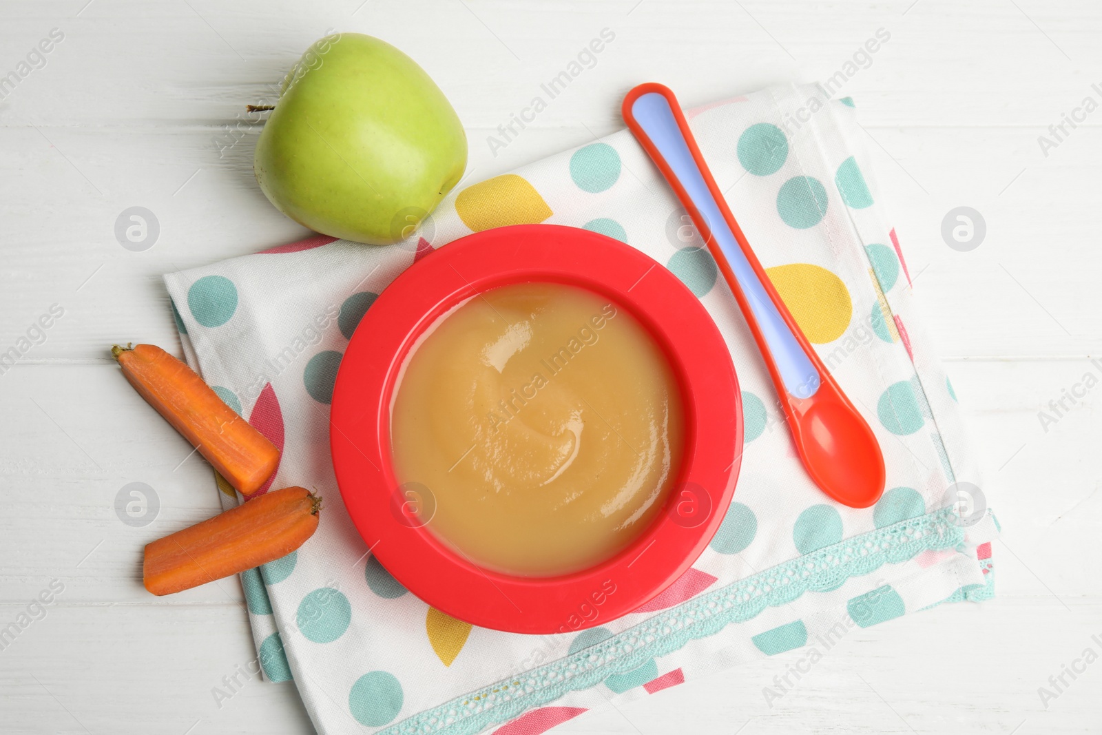 Photo of Flat lay composition with healthy baby food and ingredients on white wooden table