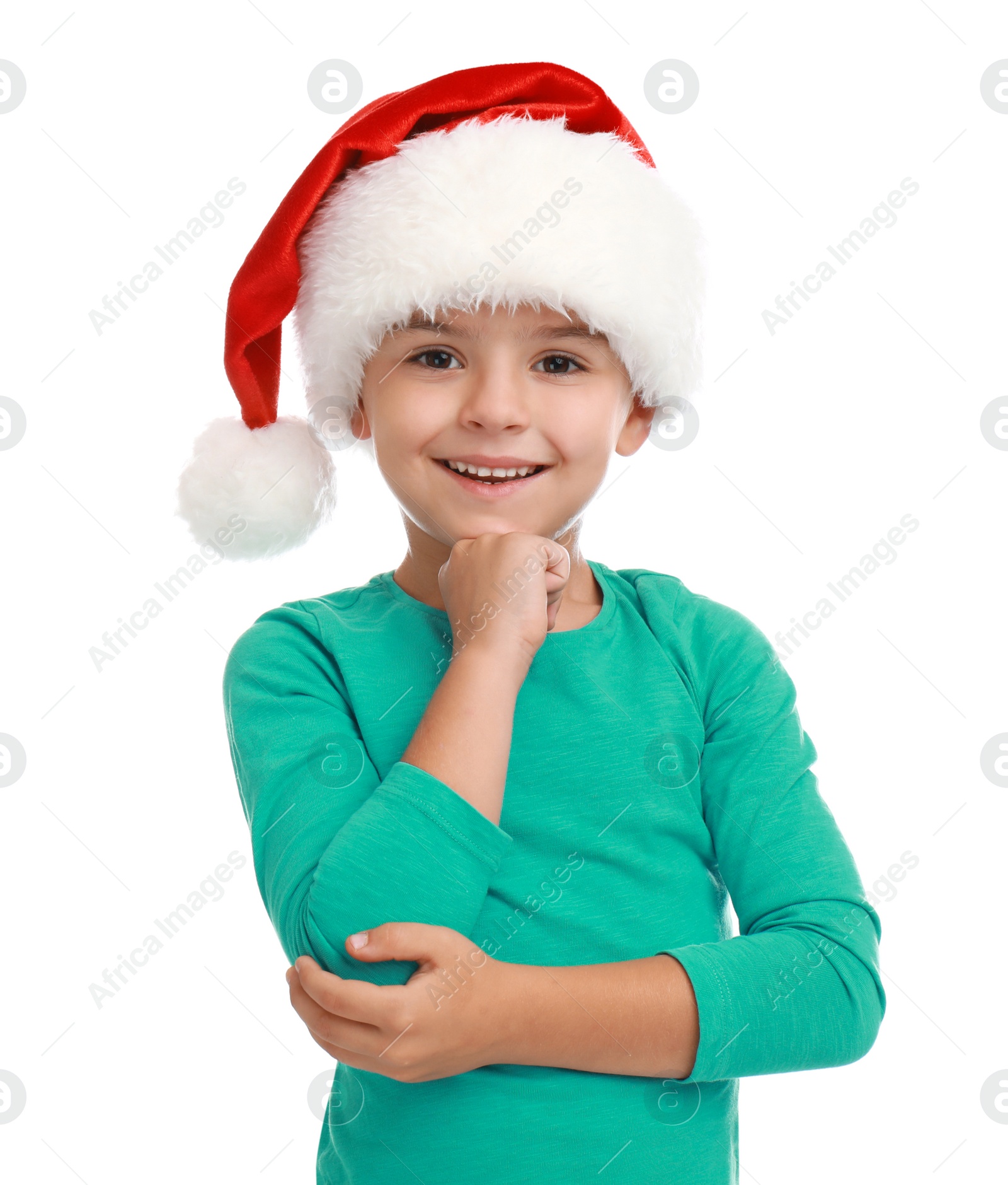 Photo of Cute little child wearing Santa hat on white background. Christmas holiday