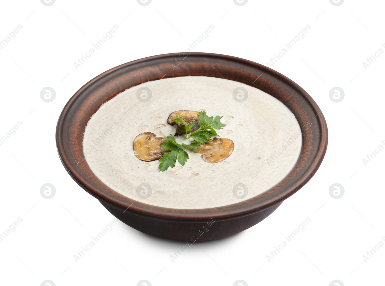 Photo of Fresh homemade mushroom soup in ceramic bowl isolated on white