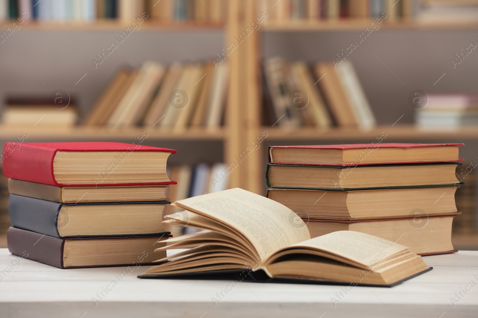 Photo of Many books on white table in library