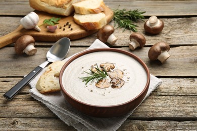 Fresh homemade mushroom soup served on wooden table