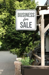 Image of Building with sign Business For Sale outdoors