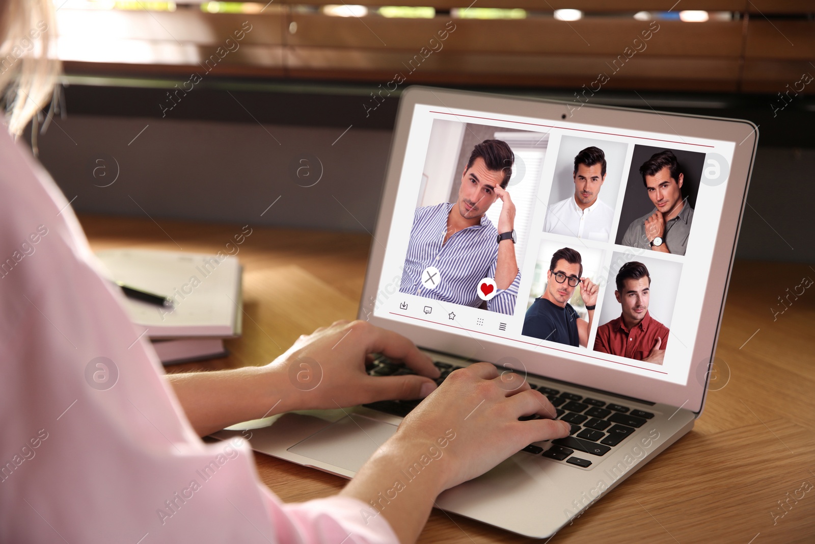 Image of Woman visiting dating site via laptop at table, closeup