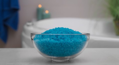 Photo of Bowl with bath salt on table in bathroom, closeup