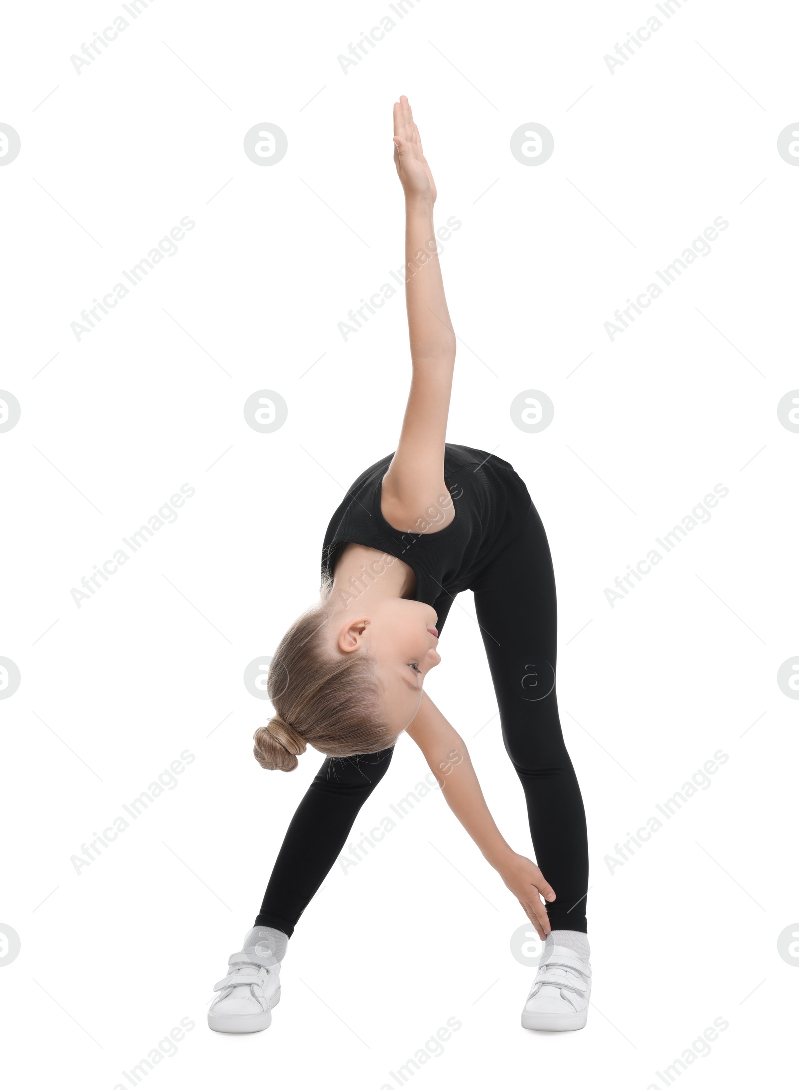 Photo of Little girl doing morning exercise on white background