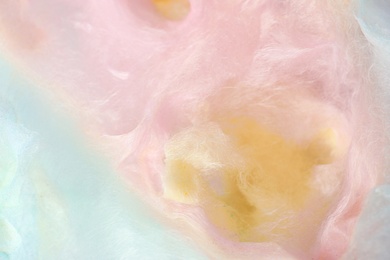 Photo of Sweet colorful cotton candy as background, closeup view