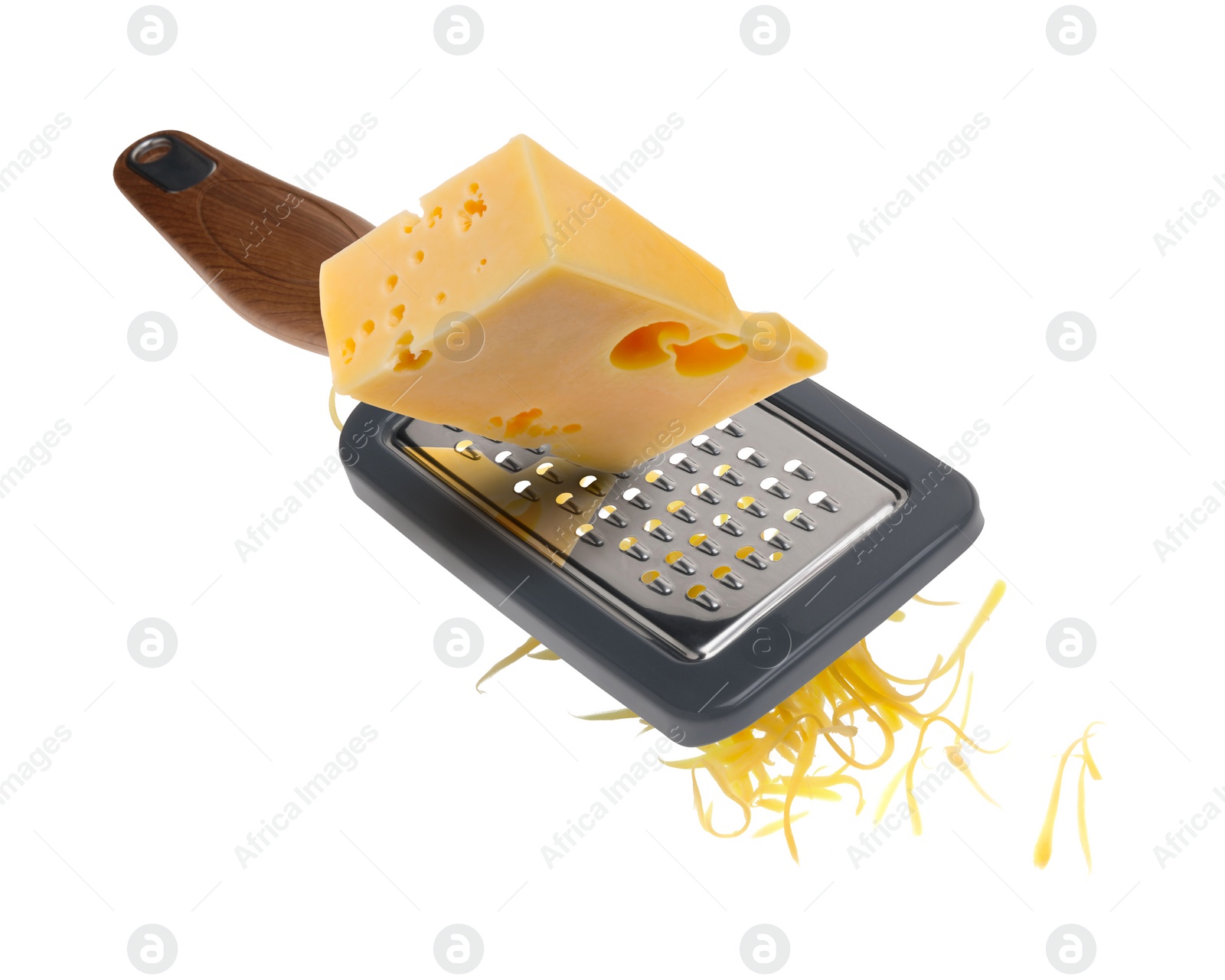 Image of Grating cheese with hand grater in air on white background