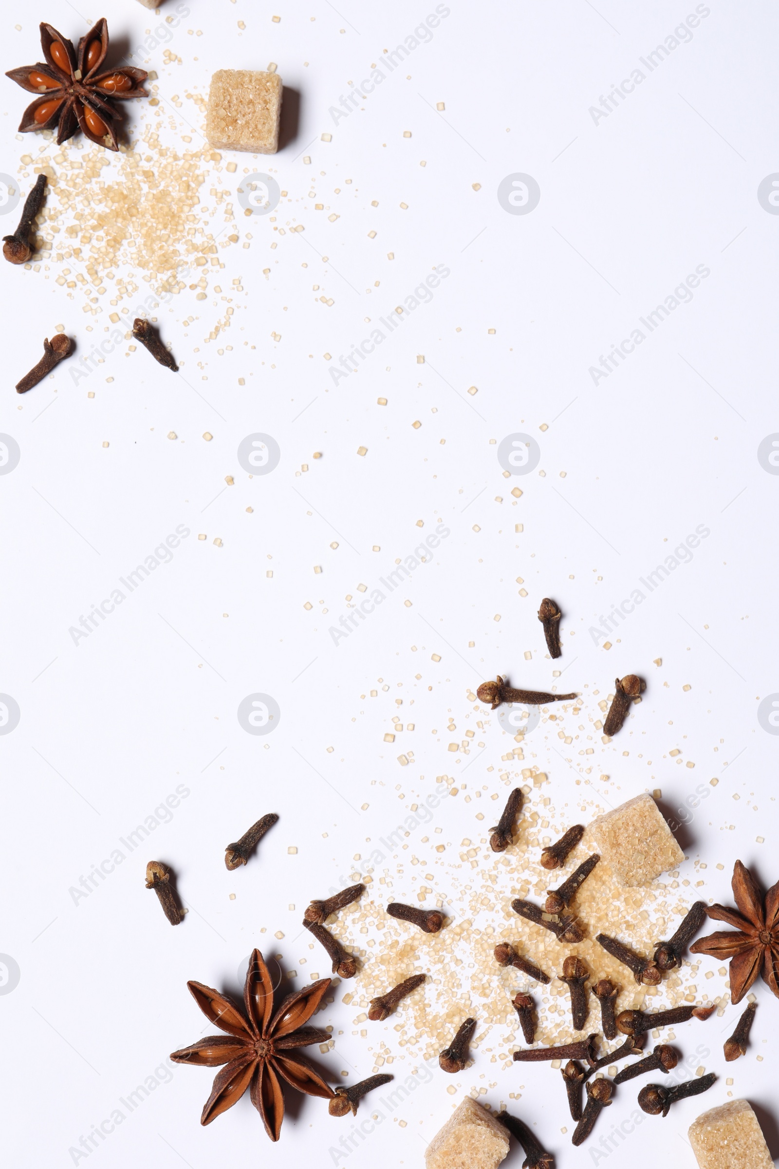 Photo of Different spices on white table, flat lay. Space for text