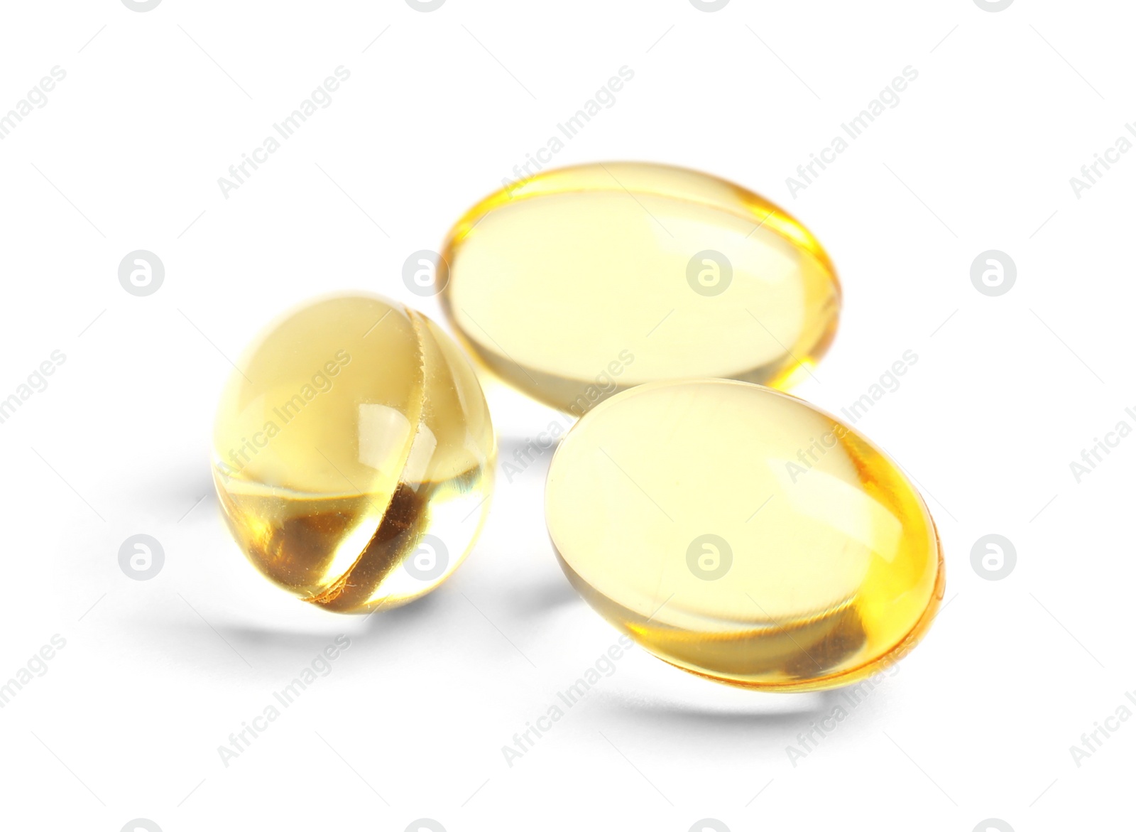 Photo of Cod liver oil pills on white background