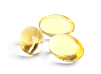 Cod liver oil pills on white background