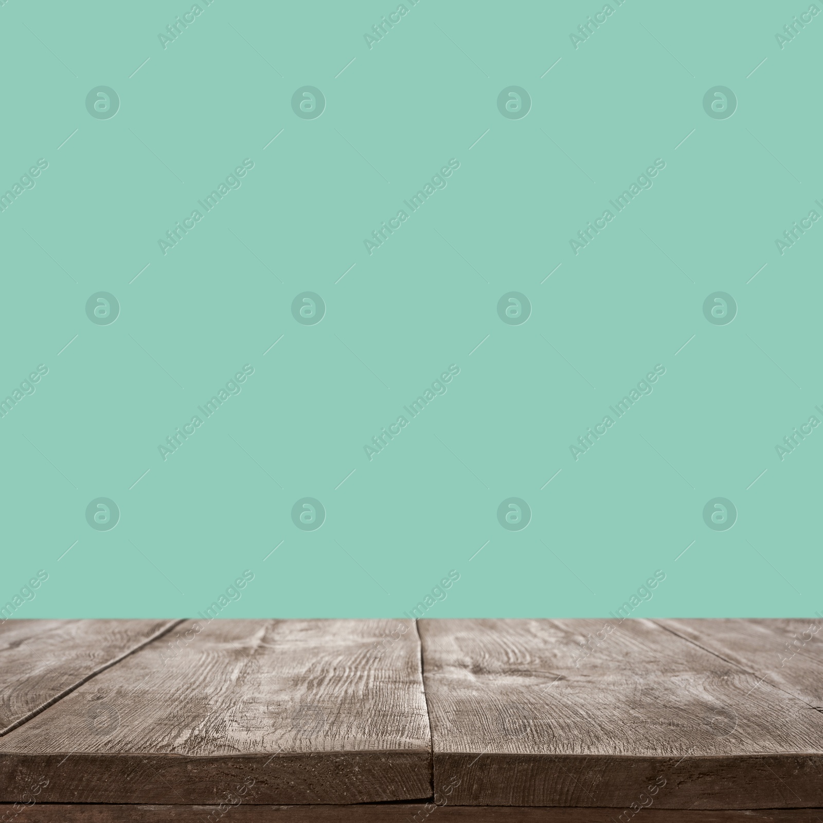 Image of Empty wooden surface on mint background. Mockup for design