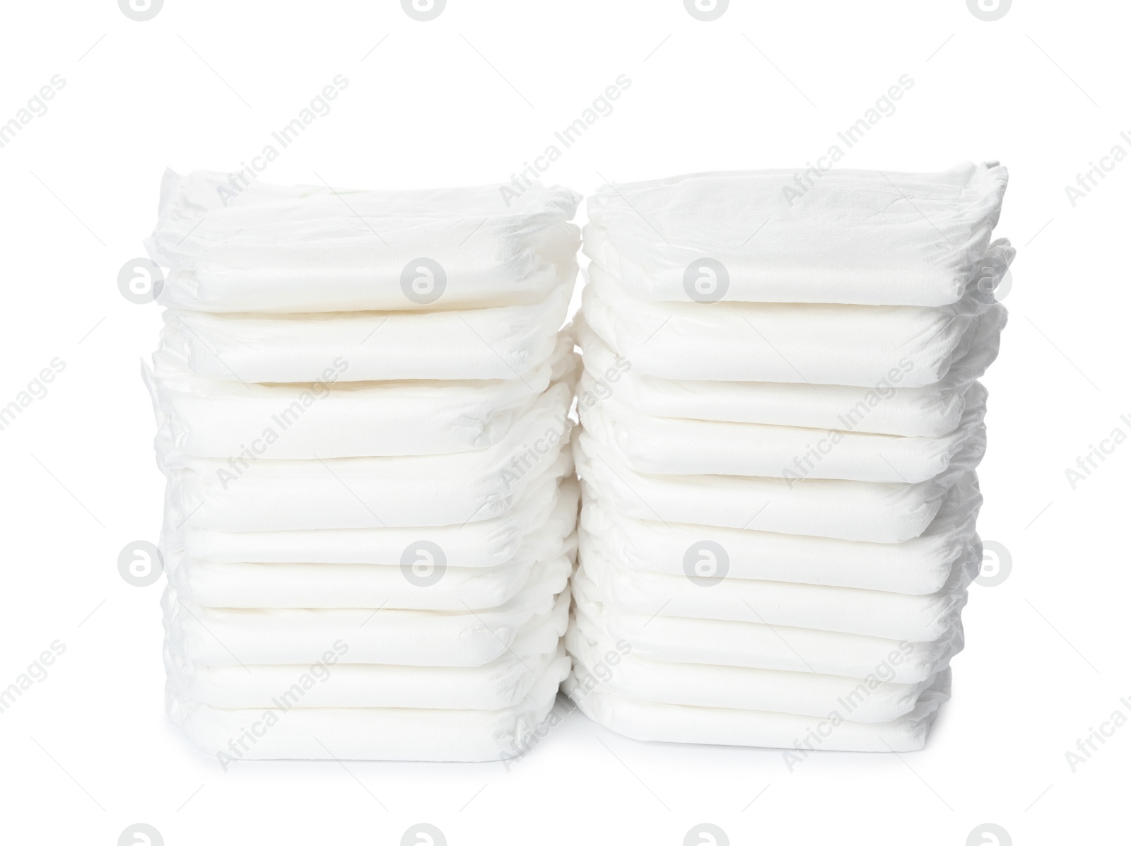 Photo of Stacks of baby diapers isolated on white