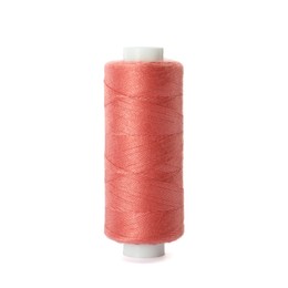 Photo of Spool of coral sewing thread isolated on white