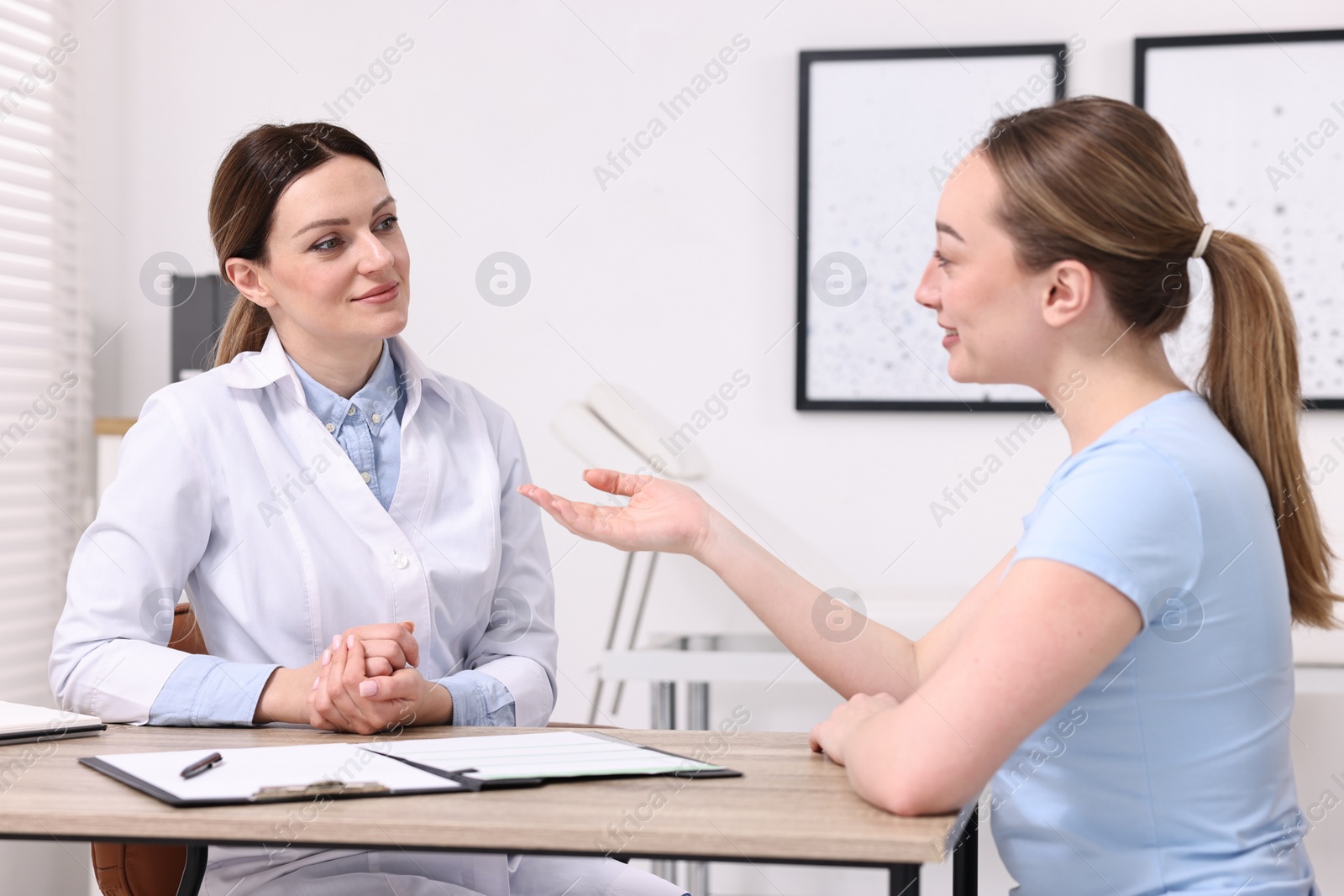 Photo of Mammologist consulting woman during appointment in hospital