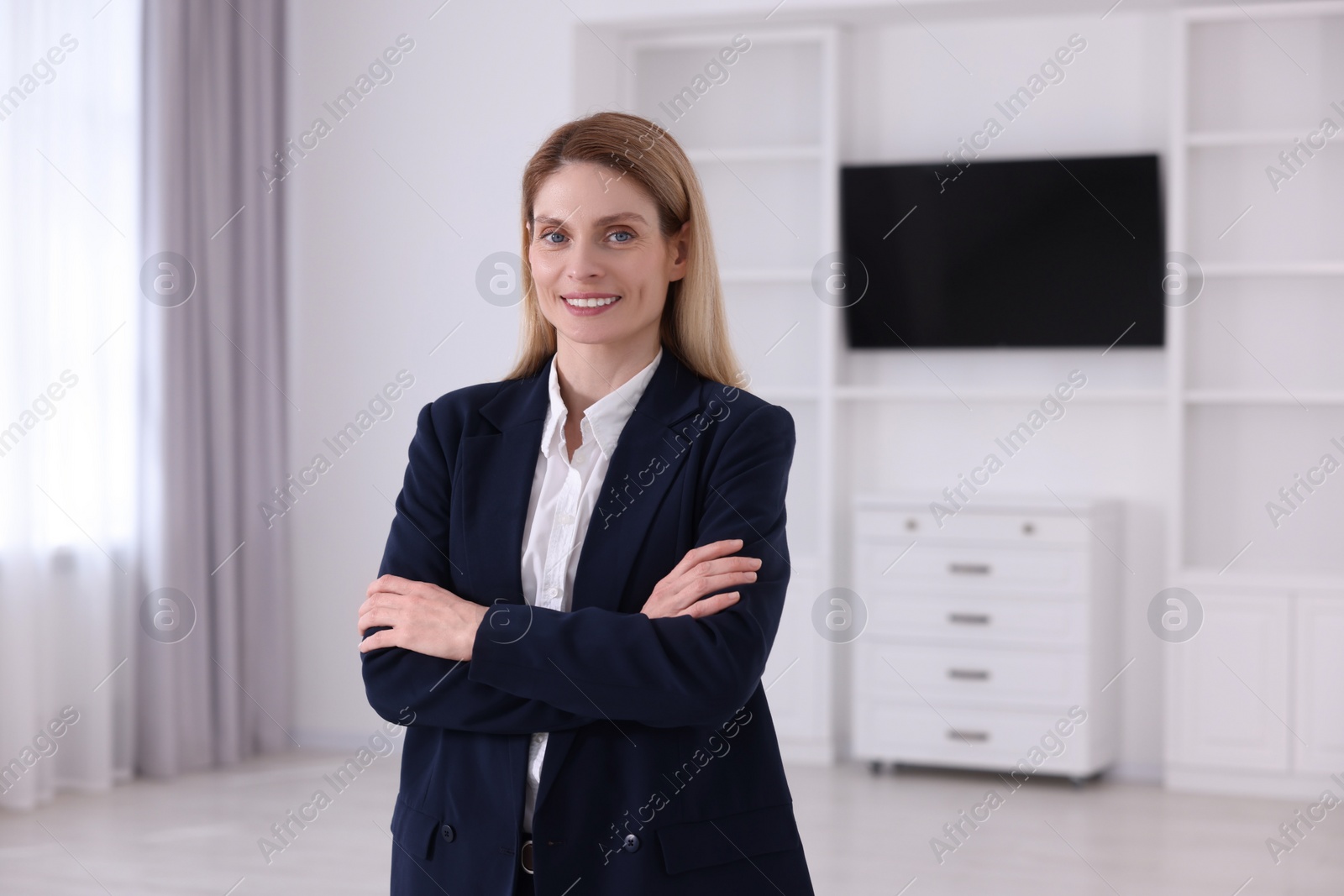 Photo of Happy real estate agent in new house