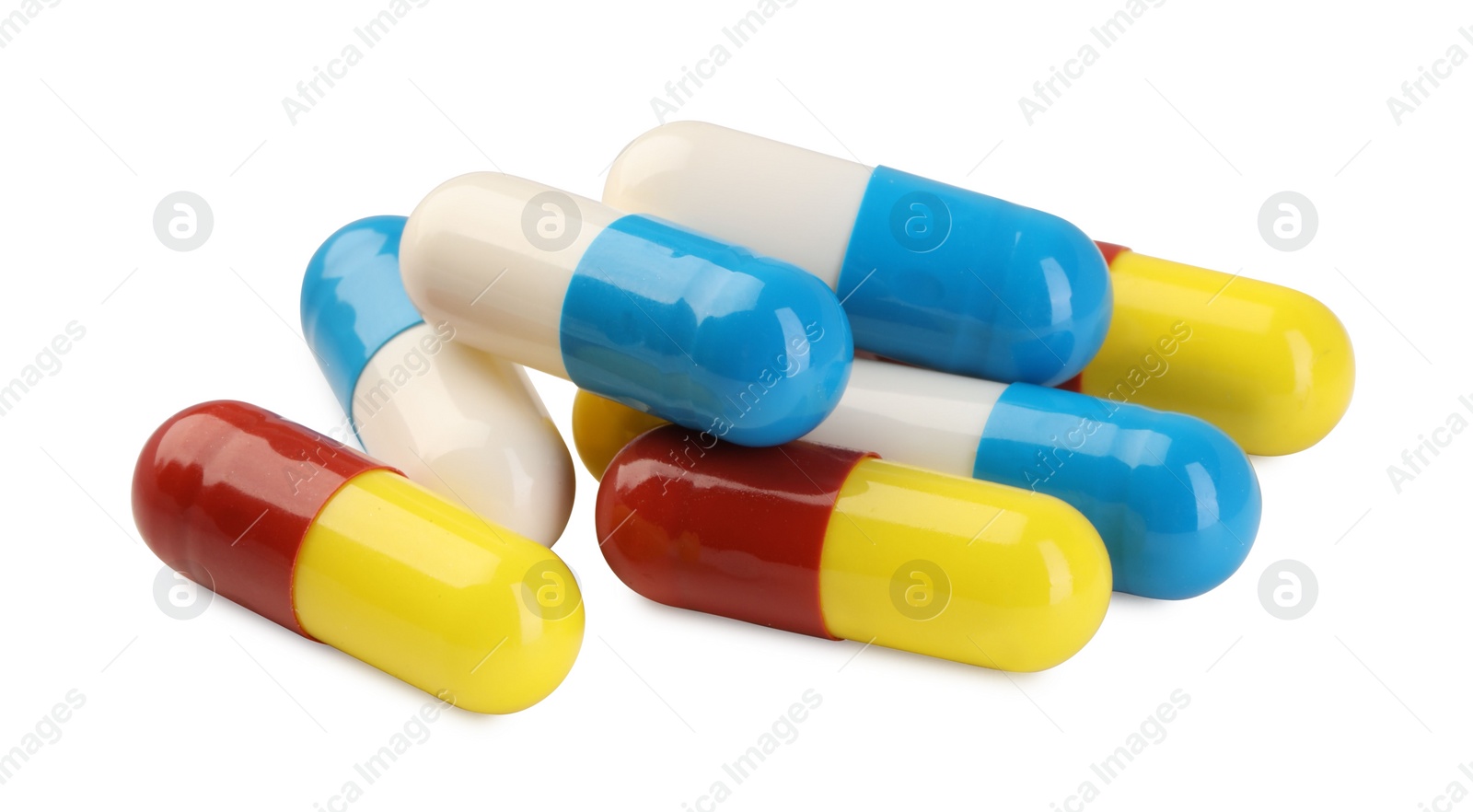 Photo of Many antibiotic pills isolated on white. Medicinal treatment