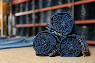 Rolled modern jeans on display in shop
