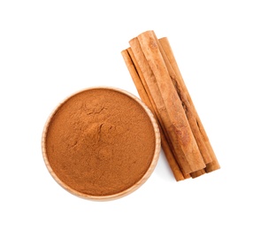 Photo of Aromatic cinnamon sticks and bowl with powder on white background, top view