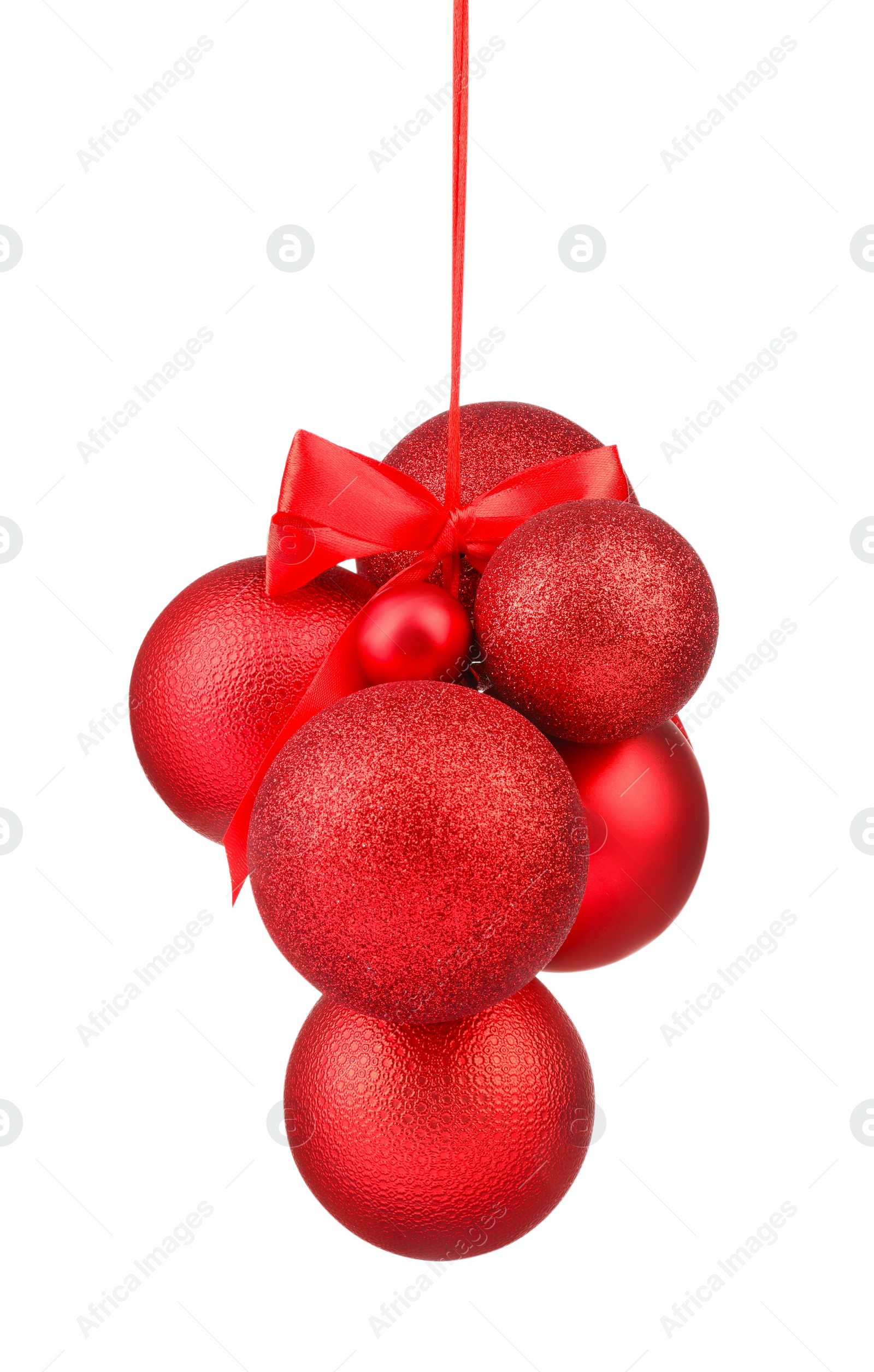Photo of Beautiful red Christmas balls with bow isolated on white