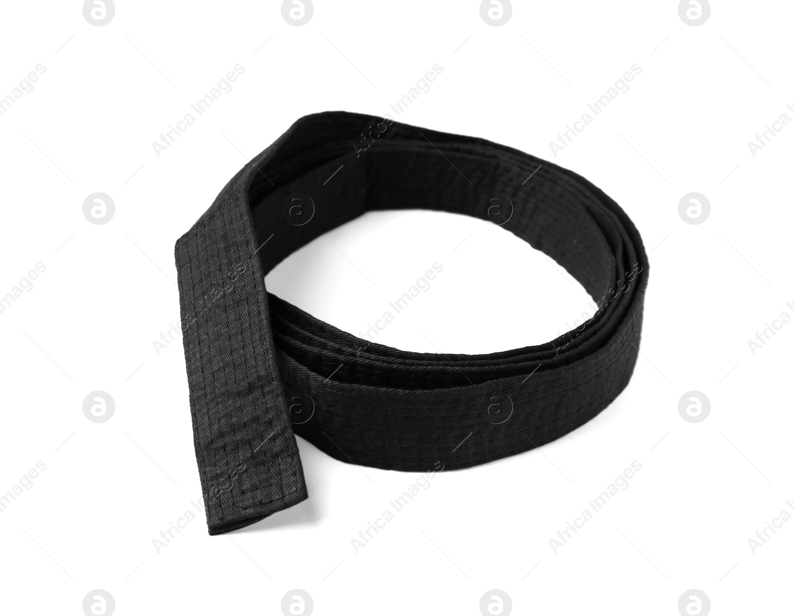 Photo of Rolled black belt on white background. Oriental martial arts