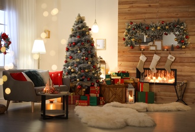 Beautiful Christmas tree in living room, bokeh effect. Festive interior