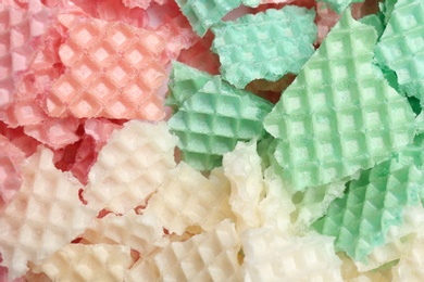 Photo of Tasty crushed wafers as background, closeup. Crispy food