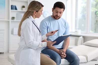 Photo of Professional doctor working with patient in hospital