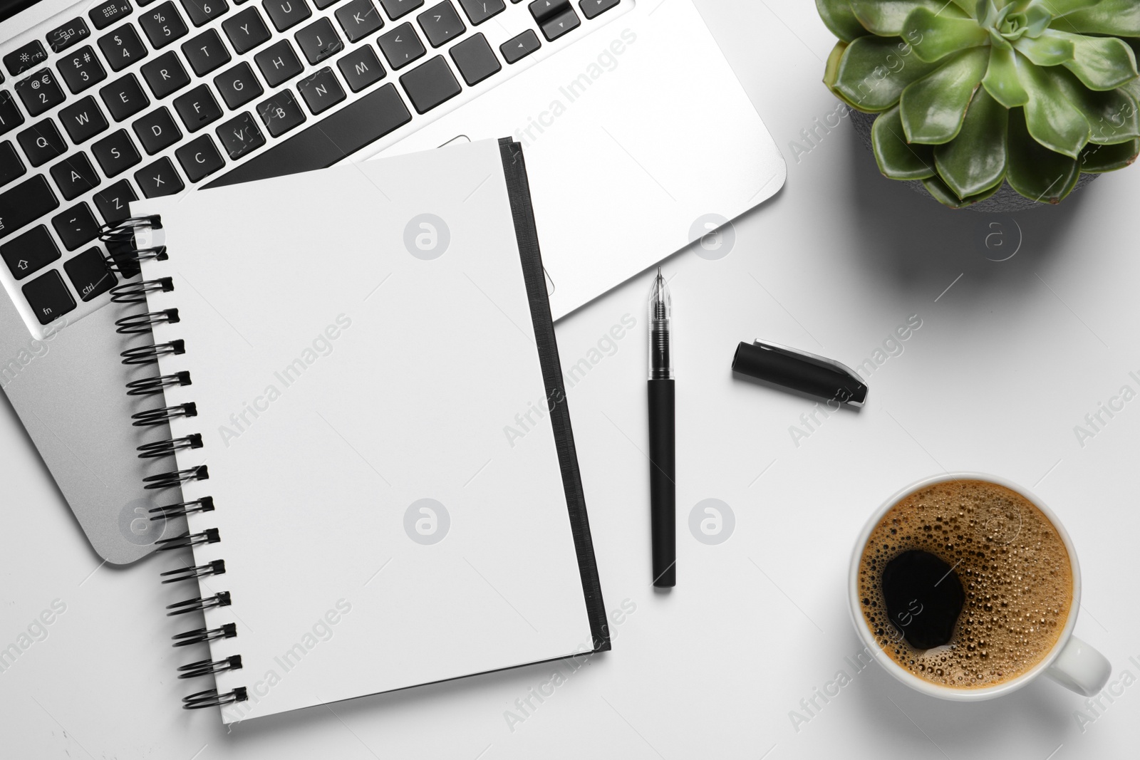 Photo of Flat lay composition with stylish notebook on white table