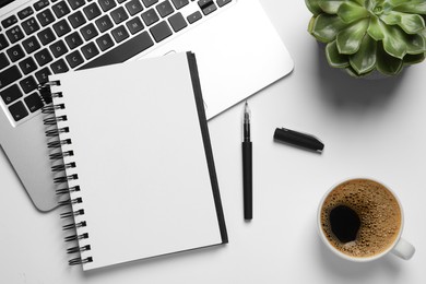 Photo of Flat lay composition with stylish notebook on white table