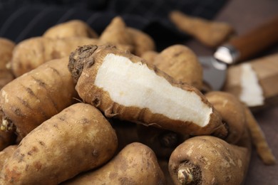 Tubers of turnip rooted chervil on table, closeup