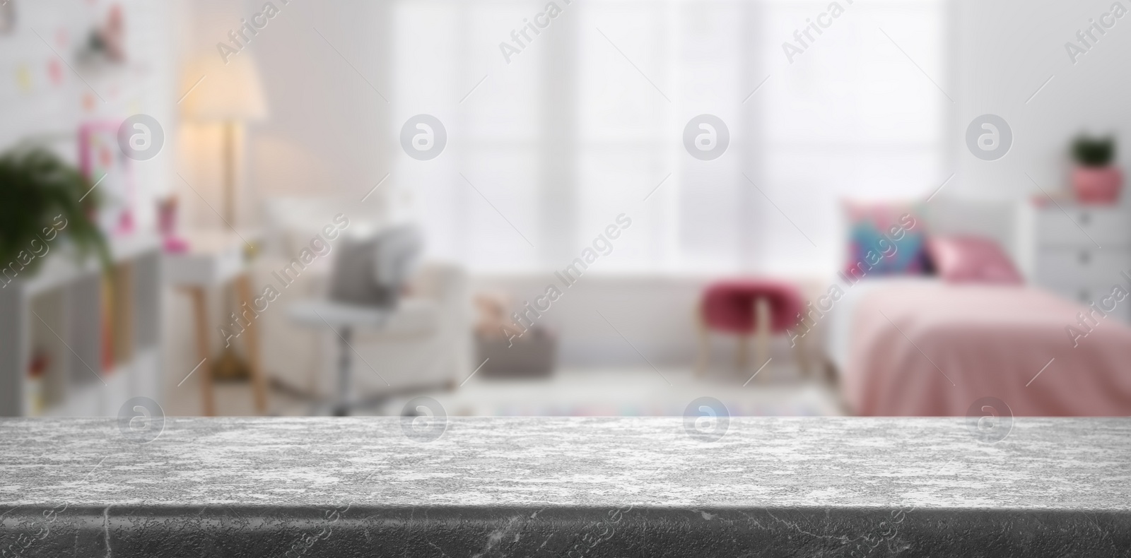 Image of Empty grey stone table in baby room interior