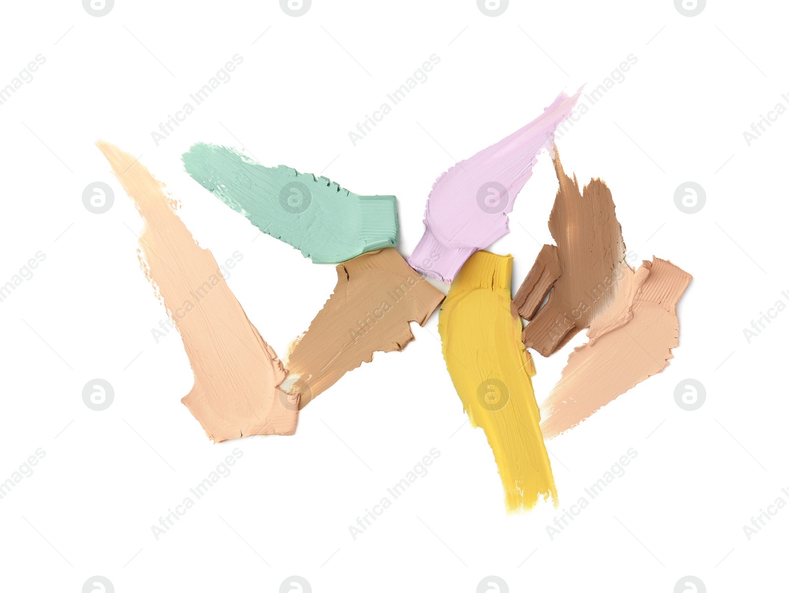 Photo of Samples of color correcting concealers isolated on white, top view