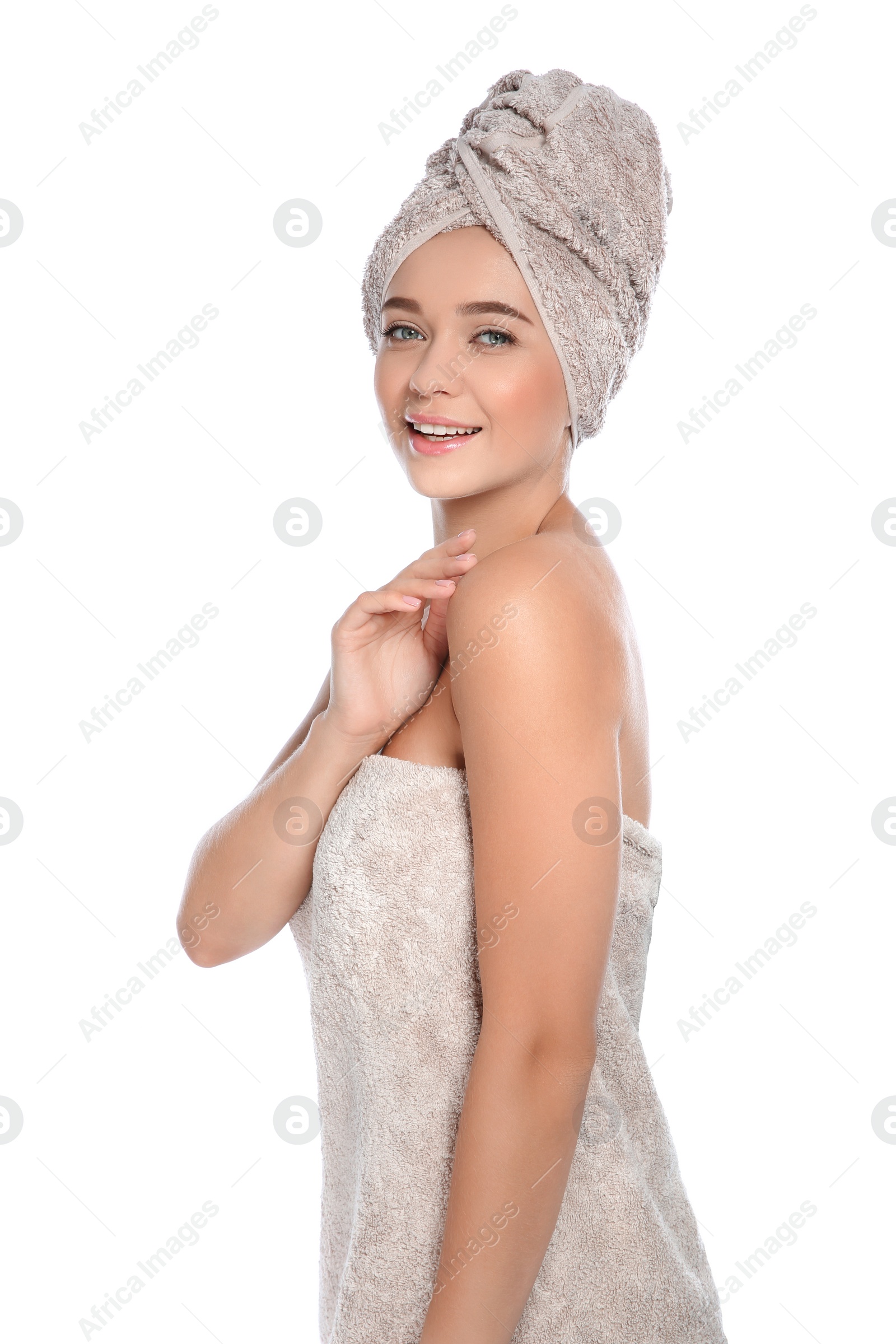 Photo of Portrait of young pretty woman with towels on white background