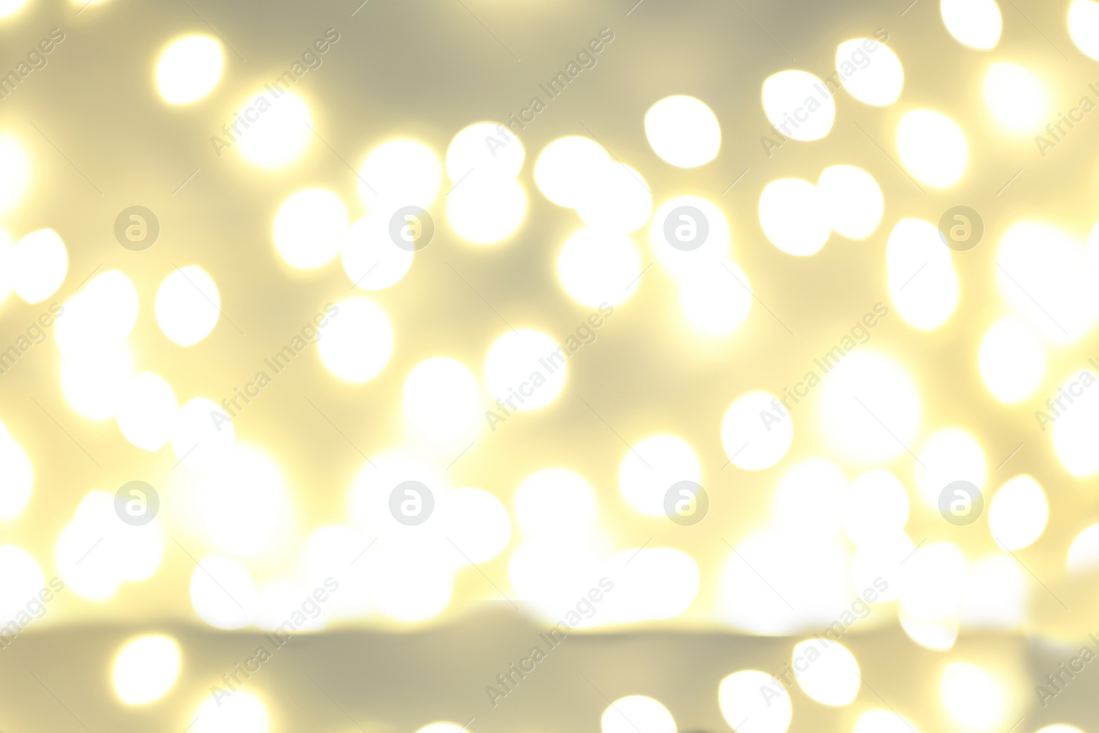 Photo of Beautiful golden lights as background. Bokeh effect